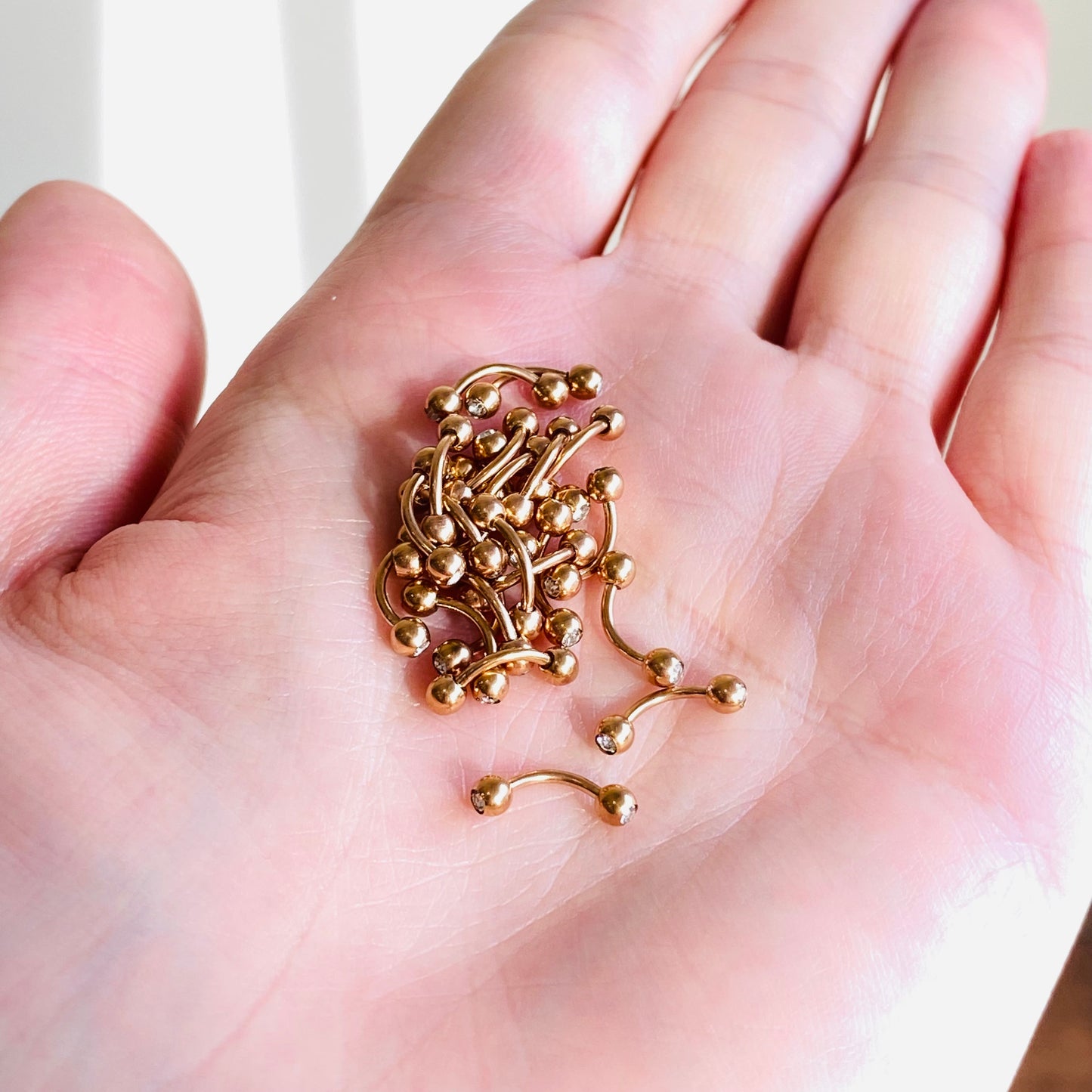 Rose Gold Ion Plated Double CZ Curved Barbell