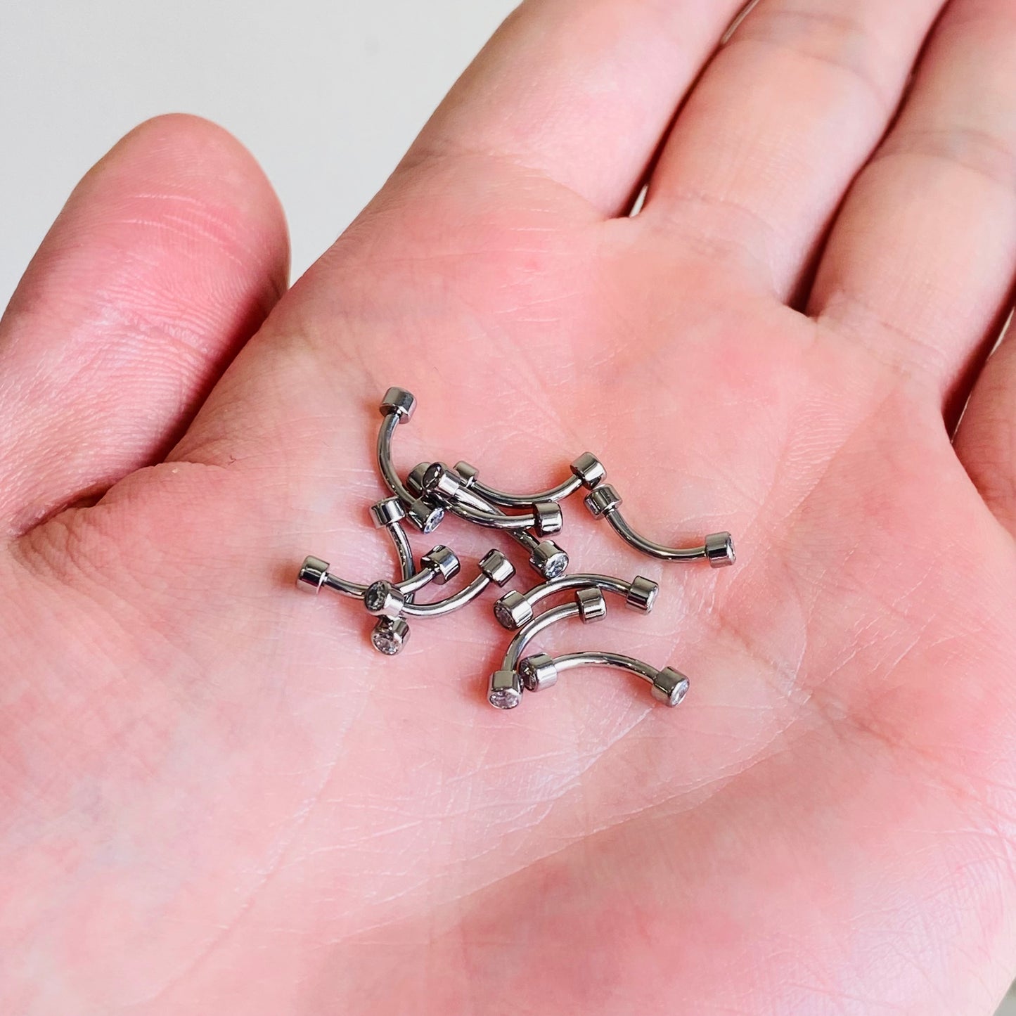 G23 Titanium Internally Threaded Bezel Set CZ Curved Barbell