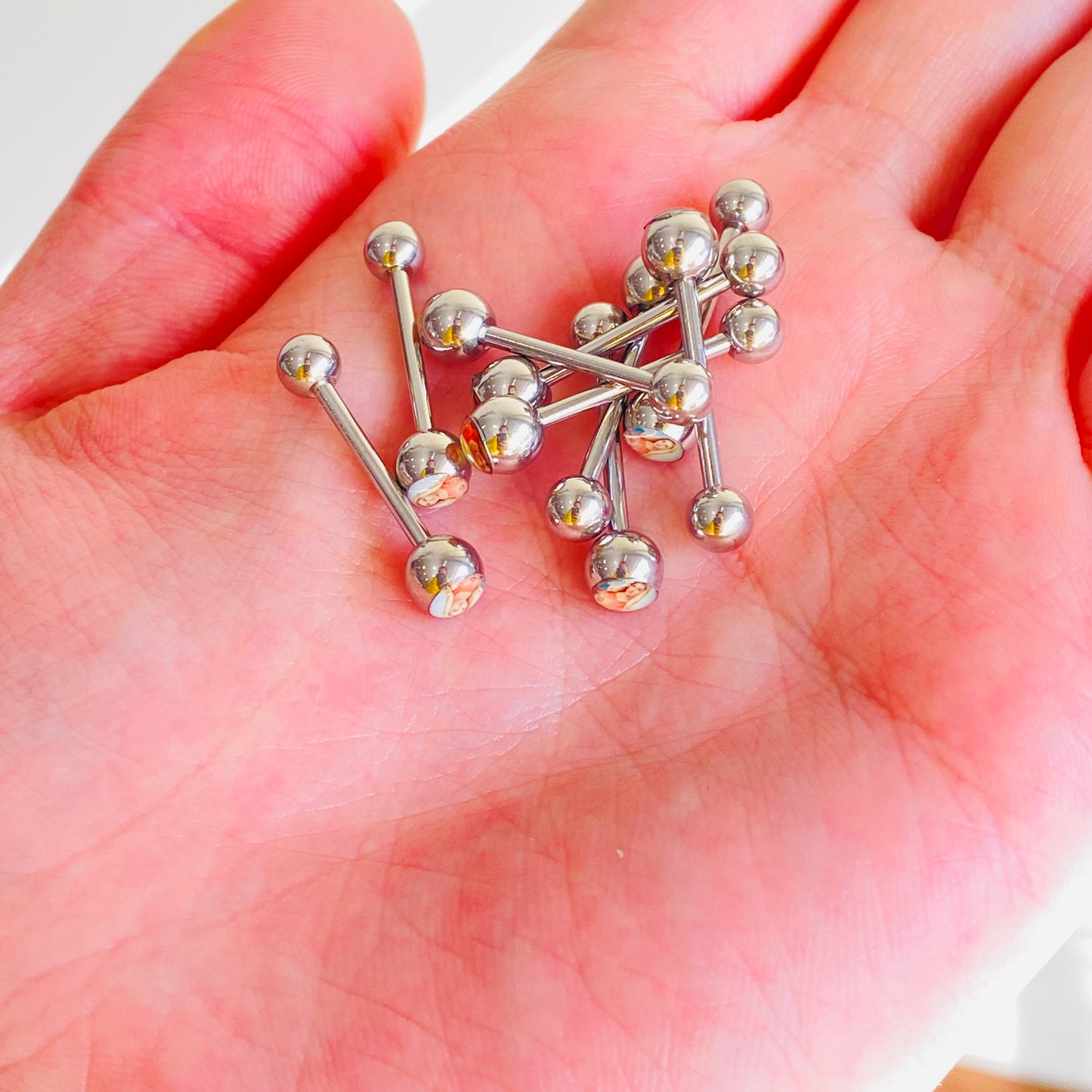 Virgin Mary Logo Tongue Ring